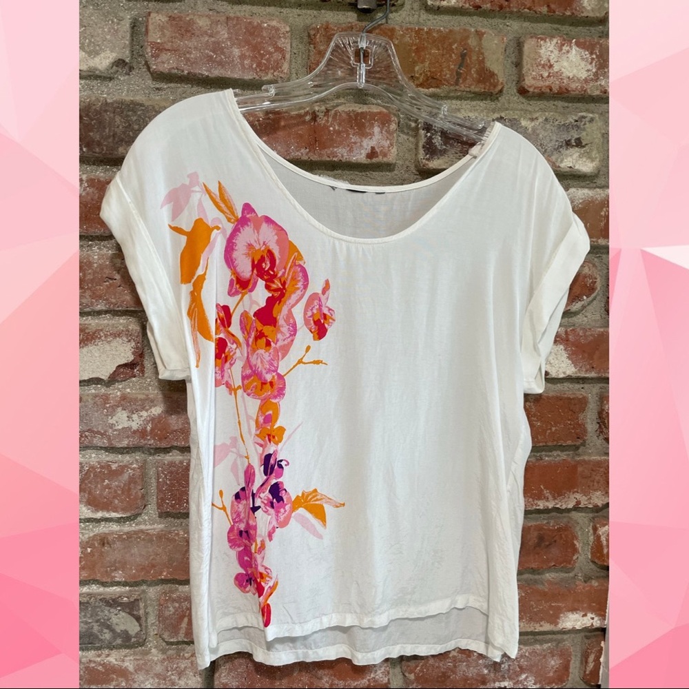 Size small white top with flower print.